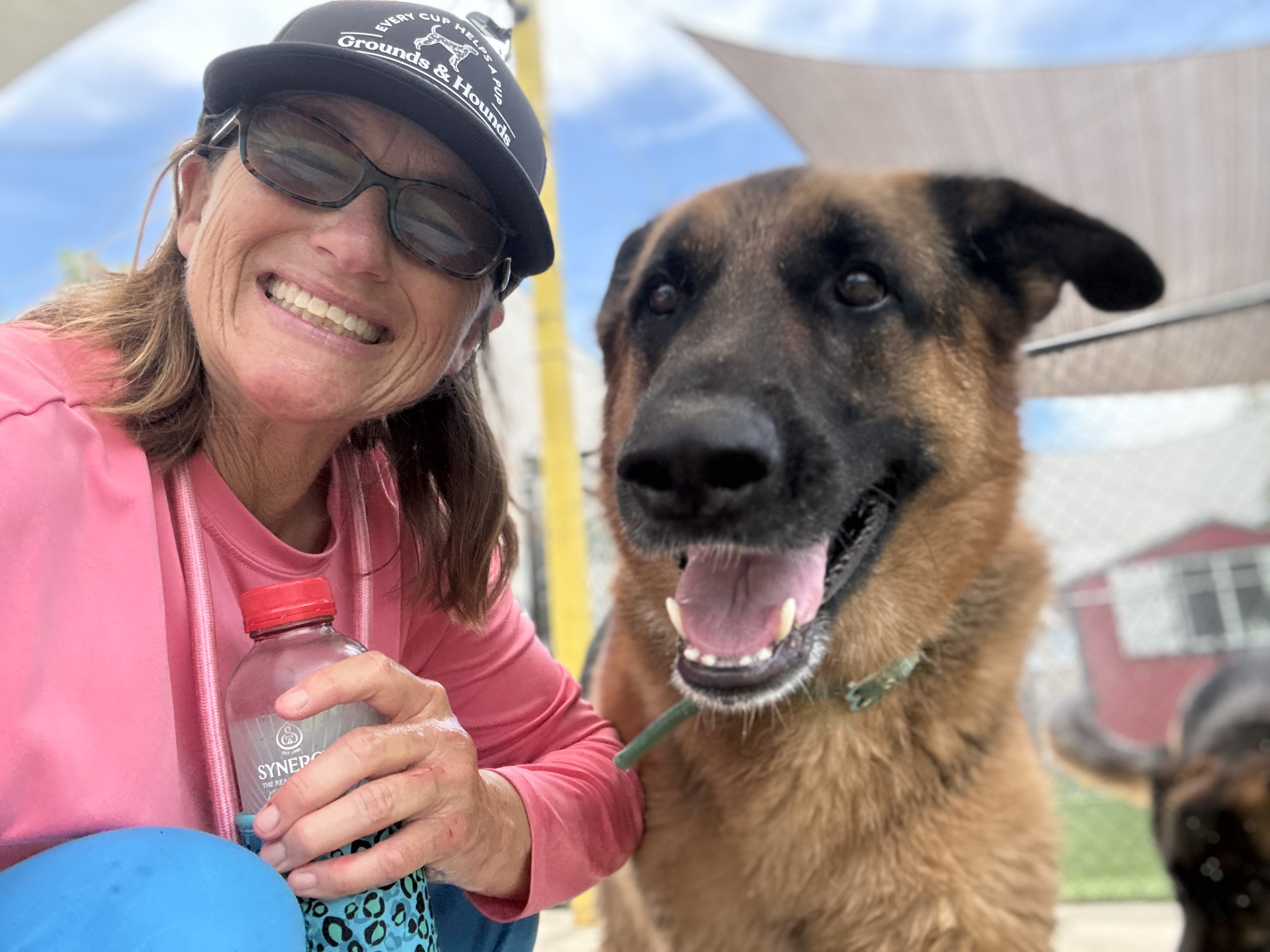 Lynette with a German Shepherd at the resort